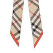 Beige Silk ScarfBurberry’s silk Check Scarf is a timeless classic, made of pure silk and decorated with the unmistakable Burberry Check print. Elegant and versatile, it adds an iconic touch to any look, confirming the distinctive style of the British fash