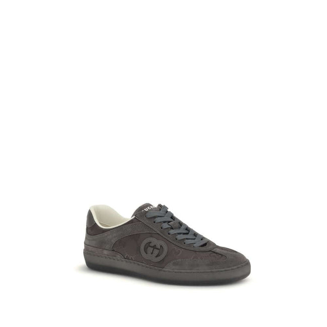 White Leather Low Top SneakersGucci’s G75 Sneakers reinterpret the retro sports aesthetic with premium materials and iconic details. Made of gray suede with GG nylon inserts, they feature a low-slung silhouette and a classic lace-up closure. The leather l