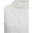 White Cotton Dress ShirtSaint Laurent’s cotton poplin Shirt combines sartorial rigor and romantic details in a sophisticated balance. Featuring a front button closure, it features a delicate Pierrot collar trimmed with lace that adds a feminine, retro tou