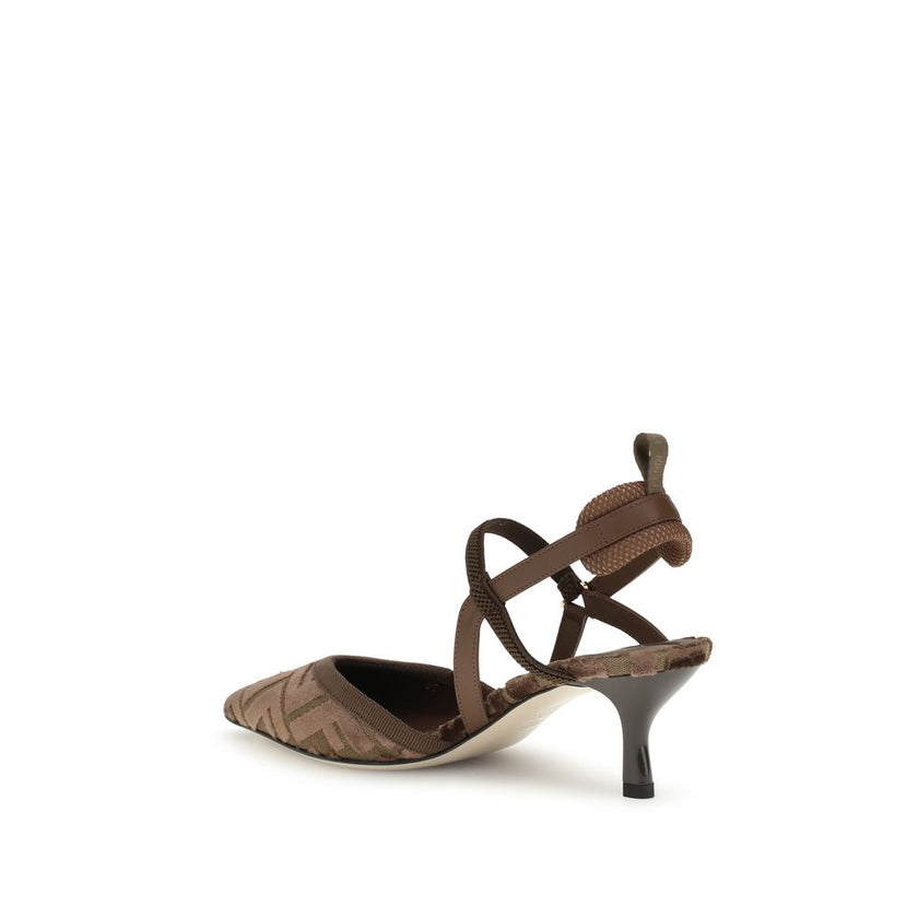Brown Fabric Mid Heel PumpsFendi’s Colibri Pumps are a sleek and modern design, perfect for those seeking a distinctive touch of luxury. The slingback design with elasticized straps ensures a comfortable and secure fit, while the almond toe gives a sleek