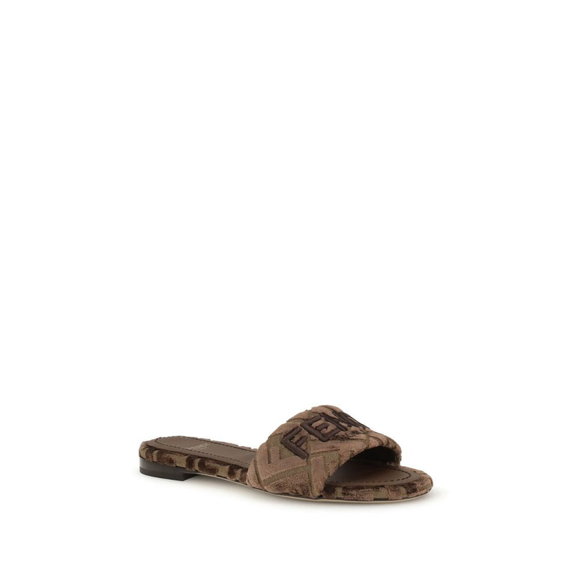 Brown Viscose Flat SandalsFendi’s Sunshine slide Sandals combine comfort and style in a practical and refined slip-on design. Featuring a round open toe, they feature an embroidered logo on the front and a signature insole that completes the look with a t