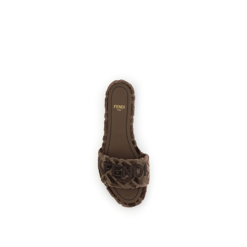 Brown Viscose Flat SandalsFendi’s Sunshine slide Sandals combine comfort and style in a practical and refined slip-on design. Featuring a round open toe, they feature an embroidered logo on the front and a signature insole that completes the look with a t