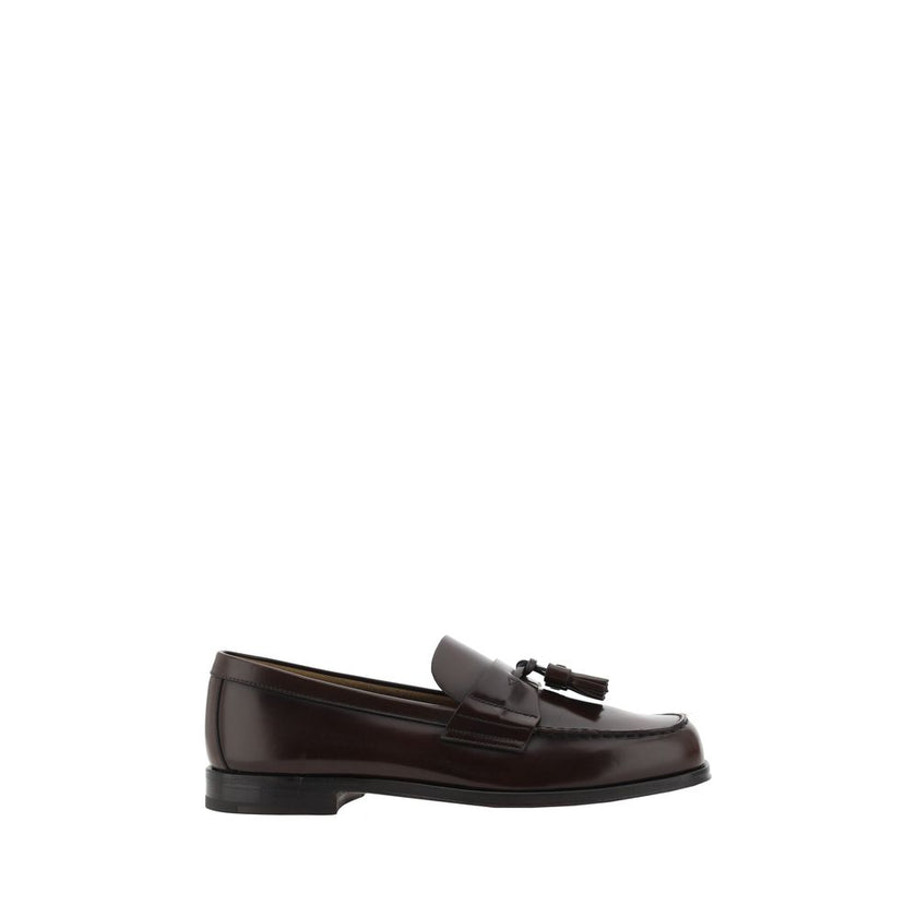 Brown Calf Leather Bos Taurus Slip-On LoafersCalfskin Loafers by Prada, slightly elongated round toe, leather block heel, front tray embellished with leather tassel, press-stamped logo insole, patent leather design. Season: AW25 Composition: 100% Calf Lea