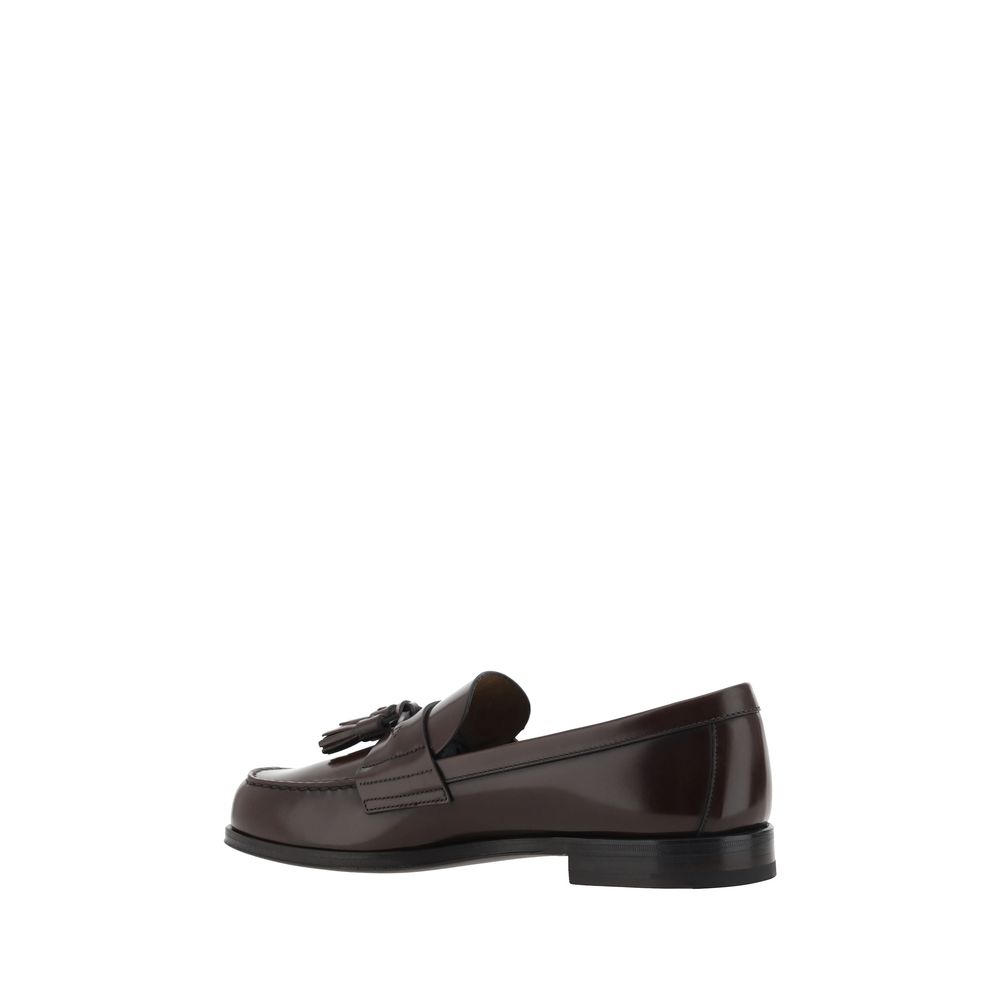 Brown Calf Leather Bos Taurus Slip-On LoafersCalfskin Loafers by Prada, slightly elongated round toe, leather block heel, front tray embellished with leather tassel, press-stamped logo insole, patent leather design. Season: AW25 Composition: 100% Calf Lea