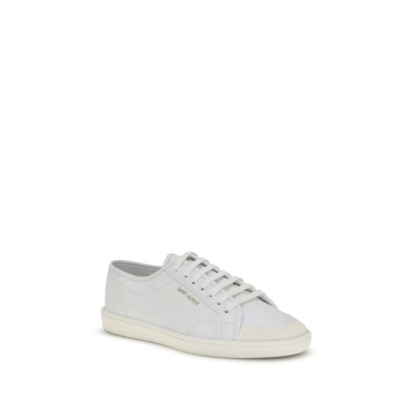 White Calf Leather Bos Taurus Low Top SneakersSaint Laurent’s Gym Sneakers are a contemporary classic, featuring a lace-up closure and a gold SAINT LAURENT signature on the side that adds a touch of understated luxury. The flat rubber sole ensures comfort