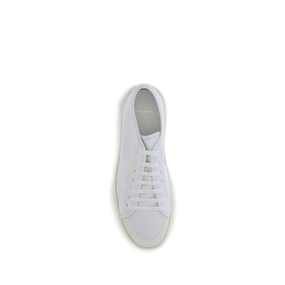 White Calf Leather Bos Taurus Low Top SneakersSaint Laurent’s Gym Sneakers are a contemporary classic, featuring a lace-up closure and a gold SAINT LAURENT signature on the side that adds a touch of understated luxury. The flat rubber sole ensures comfort