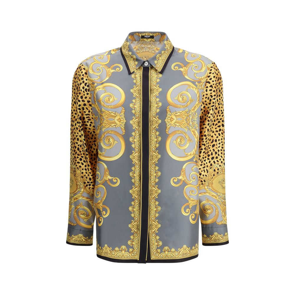 Multicolor Silk Pattern ShirtVersace’s silk Cheetah Foulard Shirt is a bold and sophisticated piece featuring a vibrant Cheetah Foulard print that combines animal motifs and baroque elements. Made from fine silk, it features long sleeves, a pointed collar