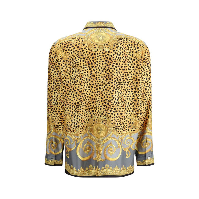Multicolor Silk Pattern ShirtVersace’s silk Cheetah Foulard Shirt is a bold and sophisticated piece featuring a vibrant Cheetah Foulard print that combines animal motifs and baroque elements. Made from fine silk, it features long sleeves, a pointed collar