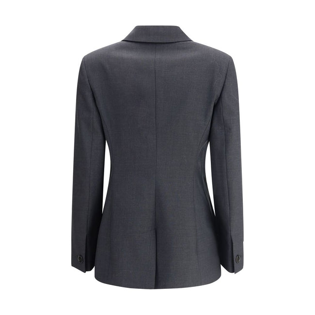 Gray Wool ClothingGucci’s wool Blazer is a classic piece with a bold style, enhanced by distinctive tailoring details. The double-breasted button closure lends structure and sophistication, while the two front welt flap pockets add functionality and symme
