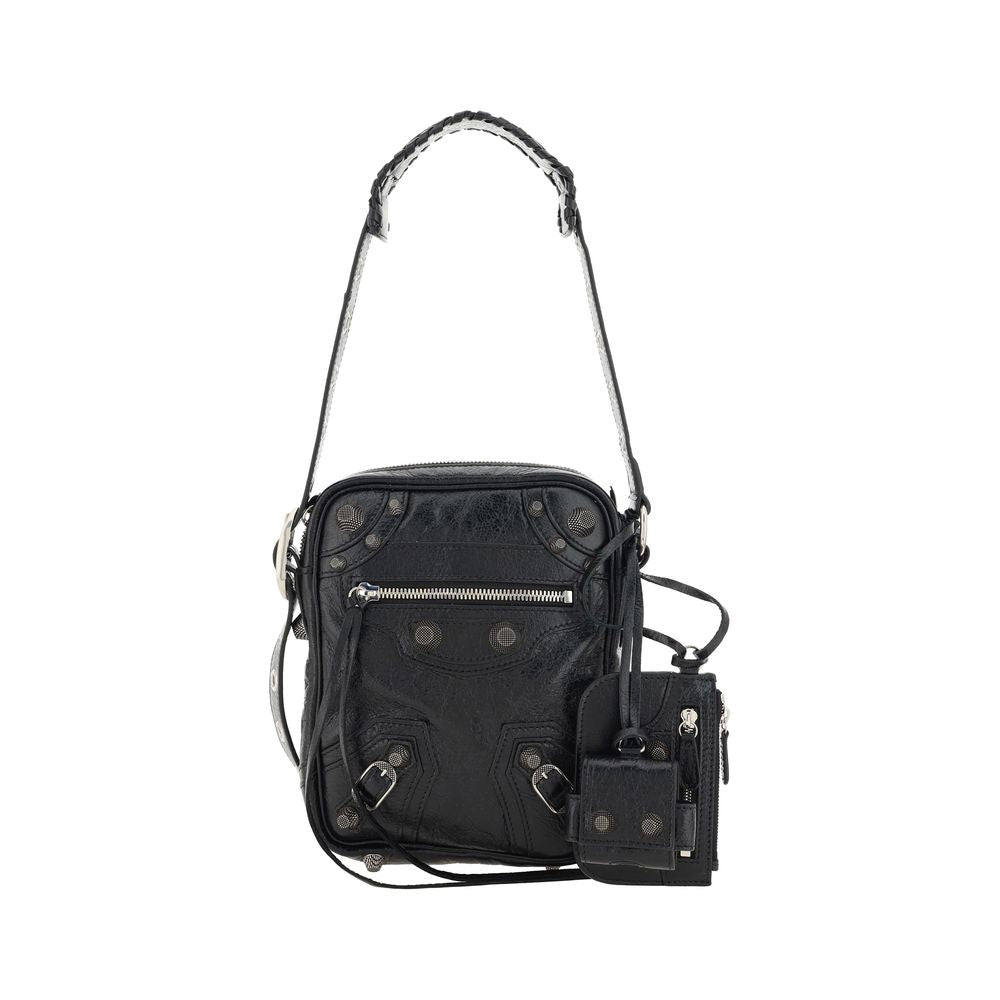 Black Lamb Ovis Aries Aries Shoulder BagLambskin Le Cagole Messenger Shoulder Bag by Balenciaga, adjustable and removable shoulder strap, all-over metallic and studded appliqué detailing, a top zip fastening, a slit pocket on the front with a zip for clos