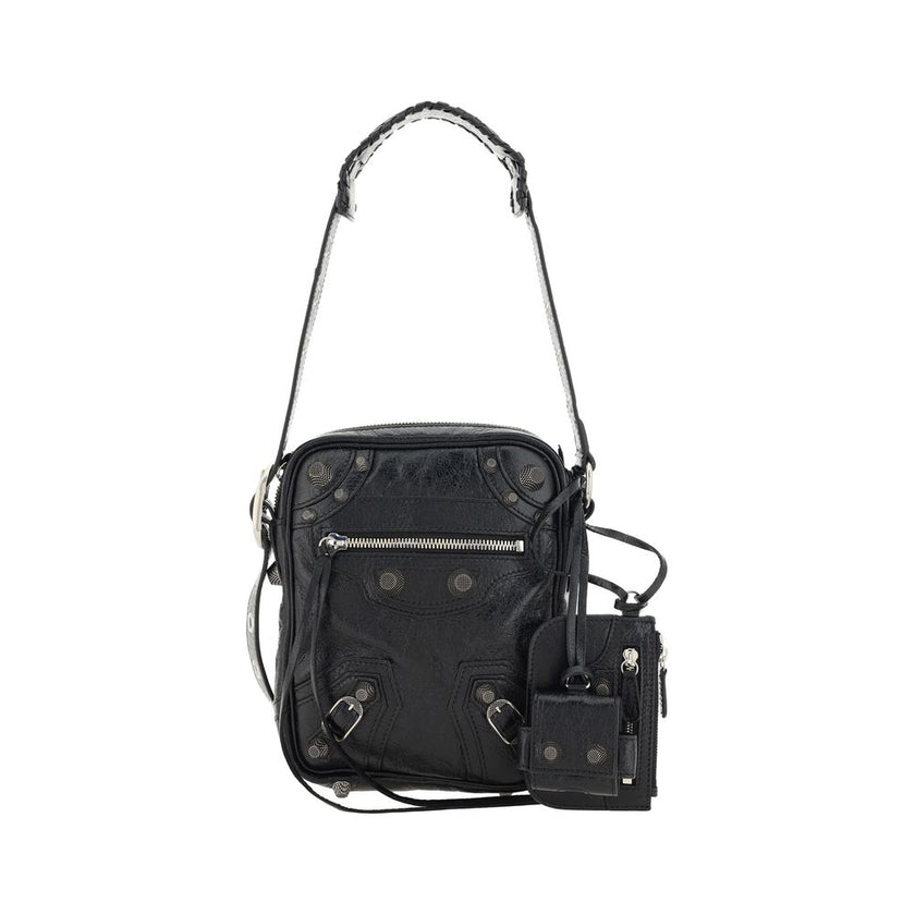 Black Lamb Ovis Aries Aries Shoulder BagLambskin Le Cagole Messenger Shoulder Bag by Balenciaga, adjustable and removable shoulder strap, all-over metallic and studded appliqué detailing, a top zip fastening, a slit pocket on the front with a zip for clos