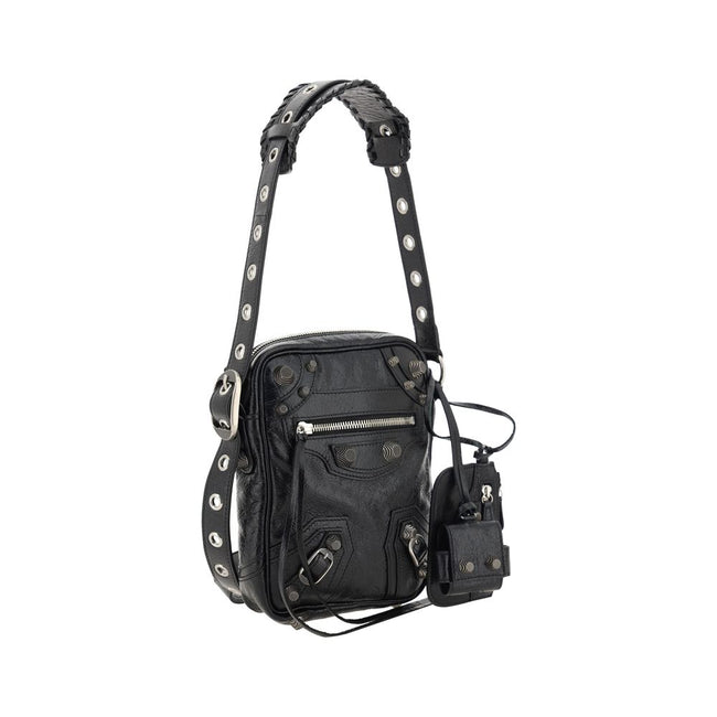 Black Lamb Ovis Aries Aries Shoulder BagLambskin Le Cagole Messenger Shoulder Bag by Balenciaga, adjustable and removable shoulder strap, all-over metallic and studded appliqué detailing, a top zip fastening, a slit pocket on the front with a zip for clos