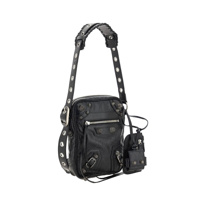 Black Lamb Ovis Aries Aries Shoulder BagLambskin Le Cagole Messenger Shoulder Bag by Balenciaga, adjustable and removable shoulder strap, all-over metallic and studded appliqué detailing, a top zip fastening, a slit pocket on the front with a zip for clos
