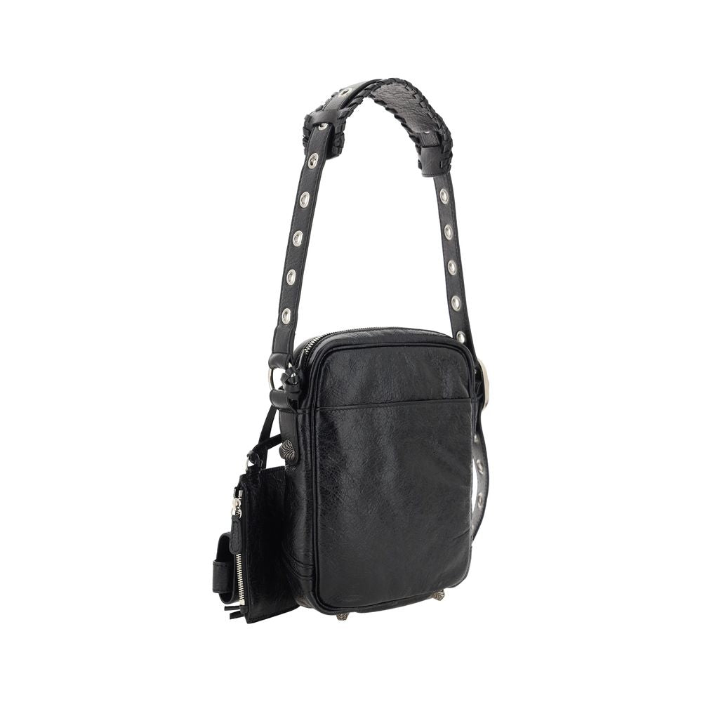 Black Lamb Ovis Aries Aries Shoulder BagLambskin Le Cagole Messenger Shoulder Bag by Balenciaga, adjustable and removable shoulder strap, all-over metallic and studded appliqué detailing, a top zip fastening, a slit pocket on the front with a zip for clos