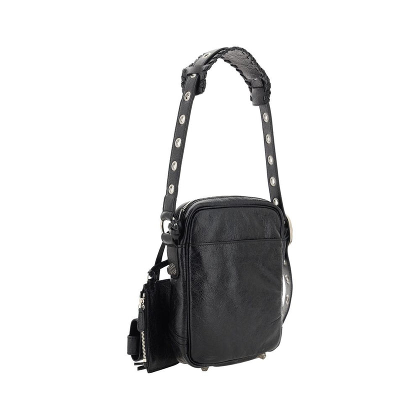 Black Lamb Ovis Aries Aries Shoulder BagLambskin Le Cagole Messenger Shoulder Bag by Balenciaga, adjustable and removable shoulder strap, all-over metallic and studded appliqué detailing, a top zip fastening, a slit pocket on the front with a zip for clos