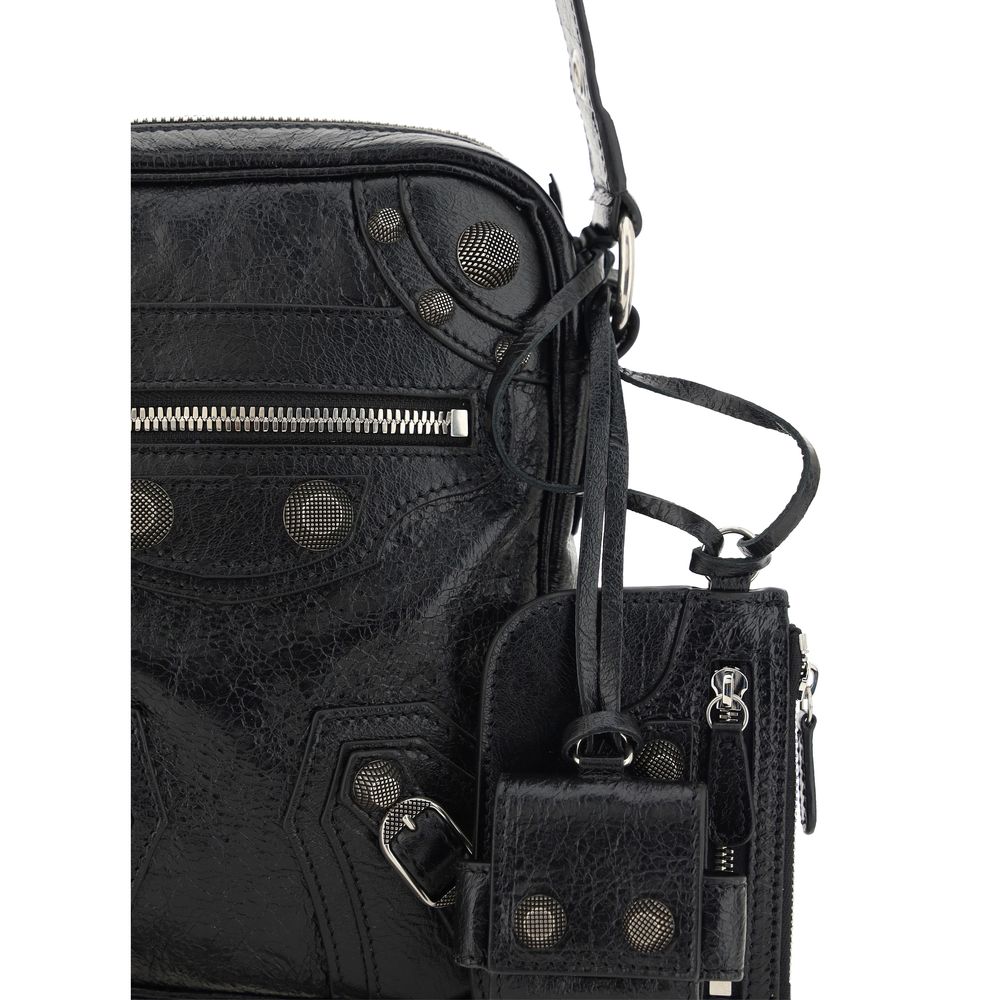 Black Lamb Ovis Aries Aries Shoulder BagLambskin Le Cagole Messenger Shoulder Bag by Balenciaga, adjustable and removable shoulder strap, all-over metallic and studded appliqué detailing, a top zip fastening, a slit pocket on the front with a zip for clos