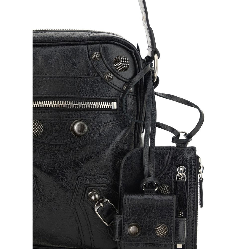 Black Lamb Ovis Aries Aries Shoulder BagLambskin Le Cagole Messenger Shoulder Bag by Balenciaga, adjustable and removable shoulder strap, all-over metallic and studded appliqué detailing, a top zip fastening, a slit pocket on the front with a zip for clos