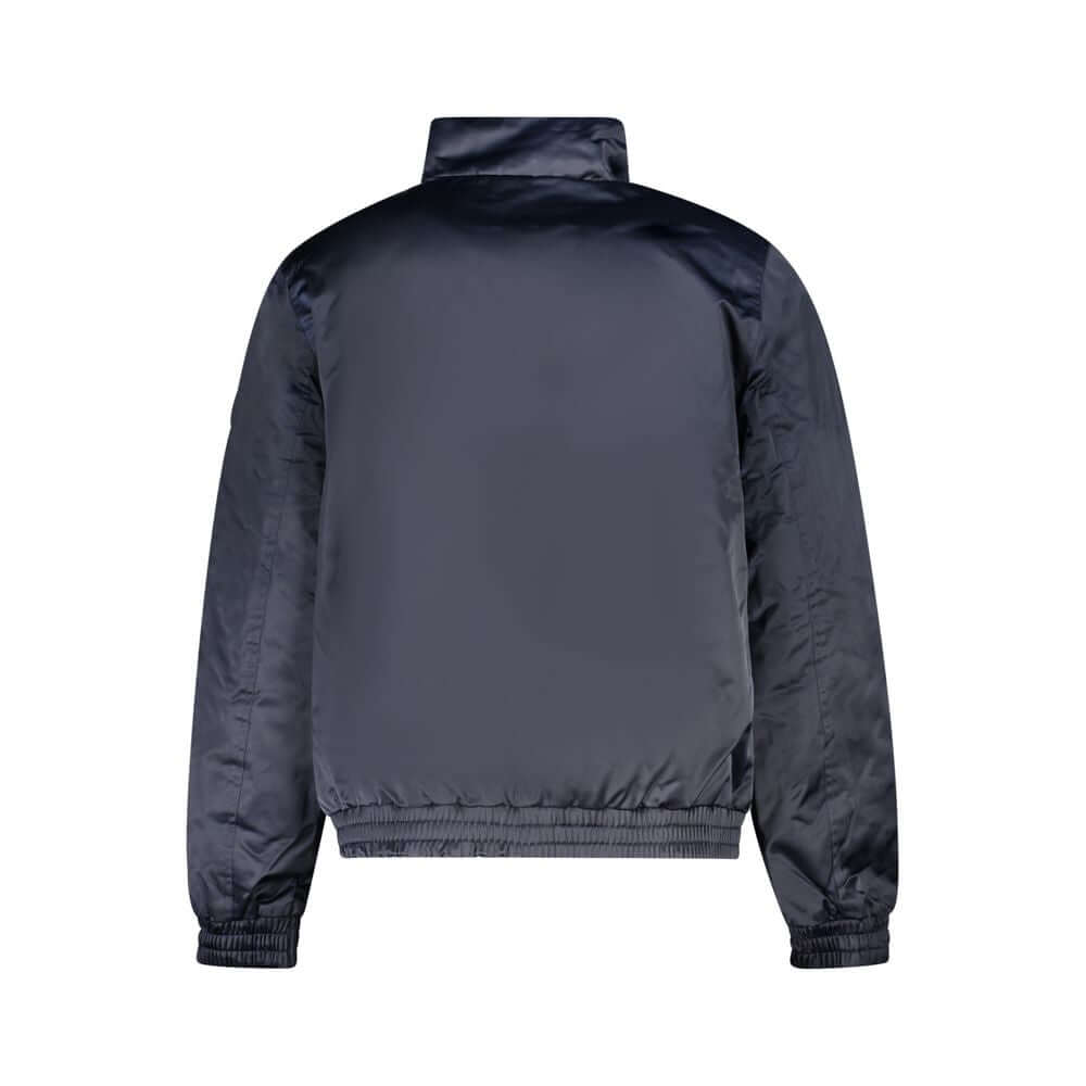 Blue Polyester Men JacketElevate your style regardless of the weather with this Calvin Klein jacket, boasting water and wind resistance for your urban adventures. The brilliant blue hue complements the sleek design, featuring a smart print, chic applique,