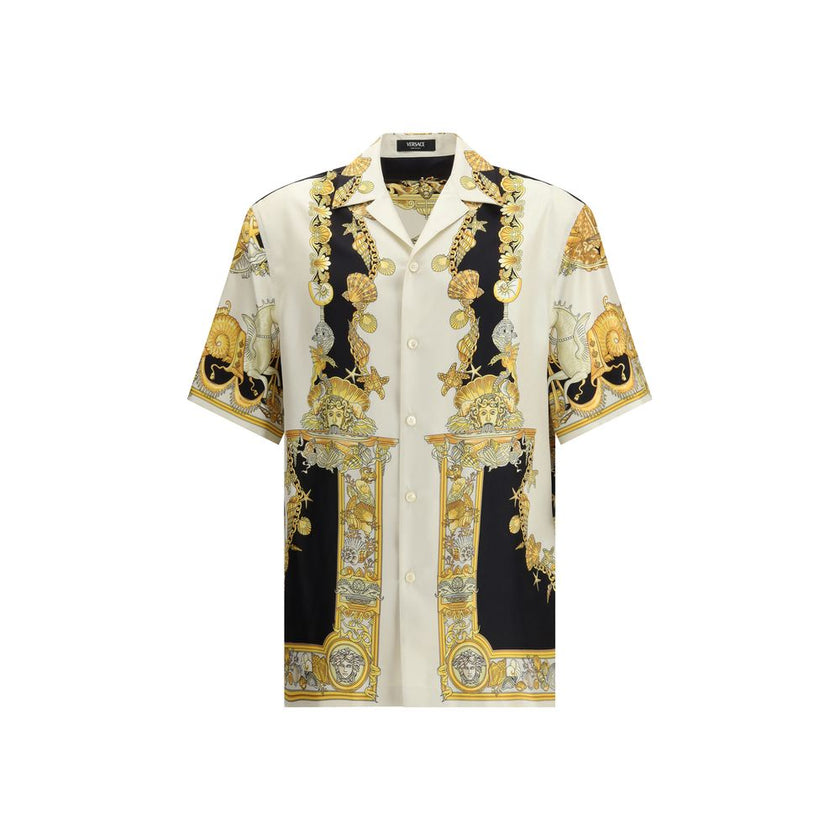 Multicolor Silk Shortsleeve ShirtVersace’s silk Theatre Shirt is a short-sleeved design with a Cuban collar and front button closure. The exclusive print depicts corals, shells and mermaids, enhanced by theatrical elements that express the Maison’s deep c