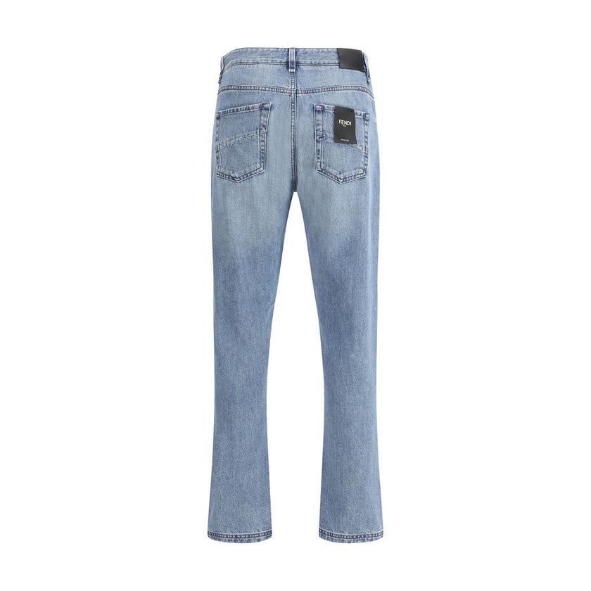 Light Blue Cotton Straight-Leg JeansFendi’s straight Jeans combine essential style with iconic details from the Maison. Featuring a straight silhouette and slim fit, they feature a classic 5-pocket design finished with rivets and custom buttons. A zip-and