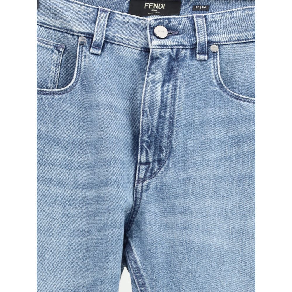 Light Blue Cotton Straight-Leg JeansFendi’s straight Jeans combine essential style with iconic details from the Maison. Featuring a straight silhouette and slim fit, they feature a classic 5-pocket design finished with rivets and custom buttons. A zip-and