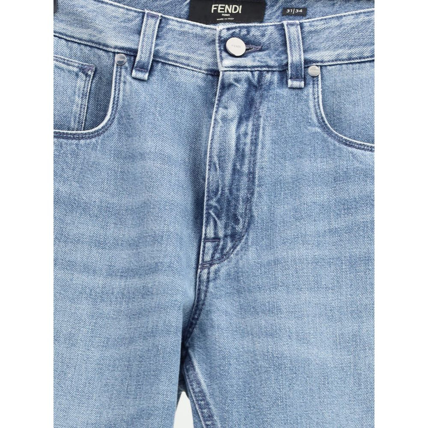 Light Blue Cotton Straight-Leg JeansFendi’s straight Jeans combine essential style with iconic details from the Maison. Featuring a straight silhouette and slim fit, they feature a classic 5-pocket design finished with rivets and custom buttons. A zip-and