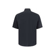 Black Cotton Shortsleeve ShirtFendi’s cotton Shirt is a summer piece with a clean and refined design. Featuring a classic collar and short sleeves, it features a front closure with concealed buttons for a minimalist effect. A zippered patch pocket stands