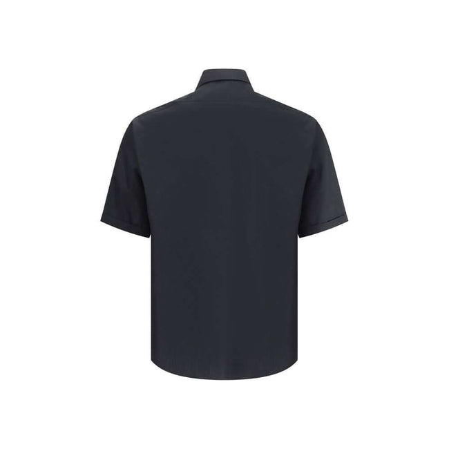 Black Cotton Shortsleeve ShirtFendi’s cotton Shirt is a summer piece with a clean and refined design. Featuring a classic collar and short sleeves, it features a front closure with concealed buttons for a minimalist effect. A zippered patch pocket stands
