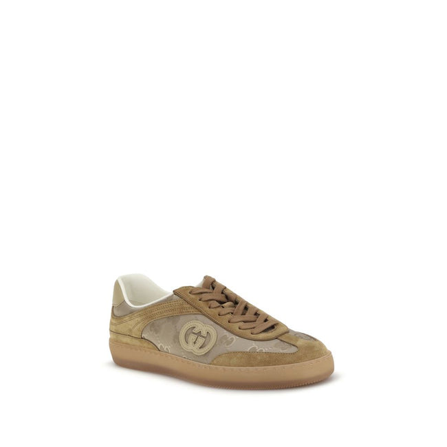 Beige Leather Athletic SneakersGucci’s G75 Sneakers reinterpret the retro sports aesthetic with premium materials and iconic details. Made of gray suede with GG nylon inserts, they feature a low-slung silhouette and a classic lace-up closure. The leather