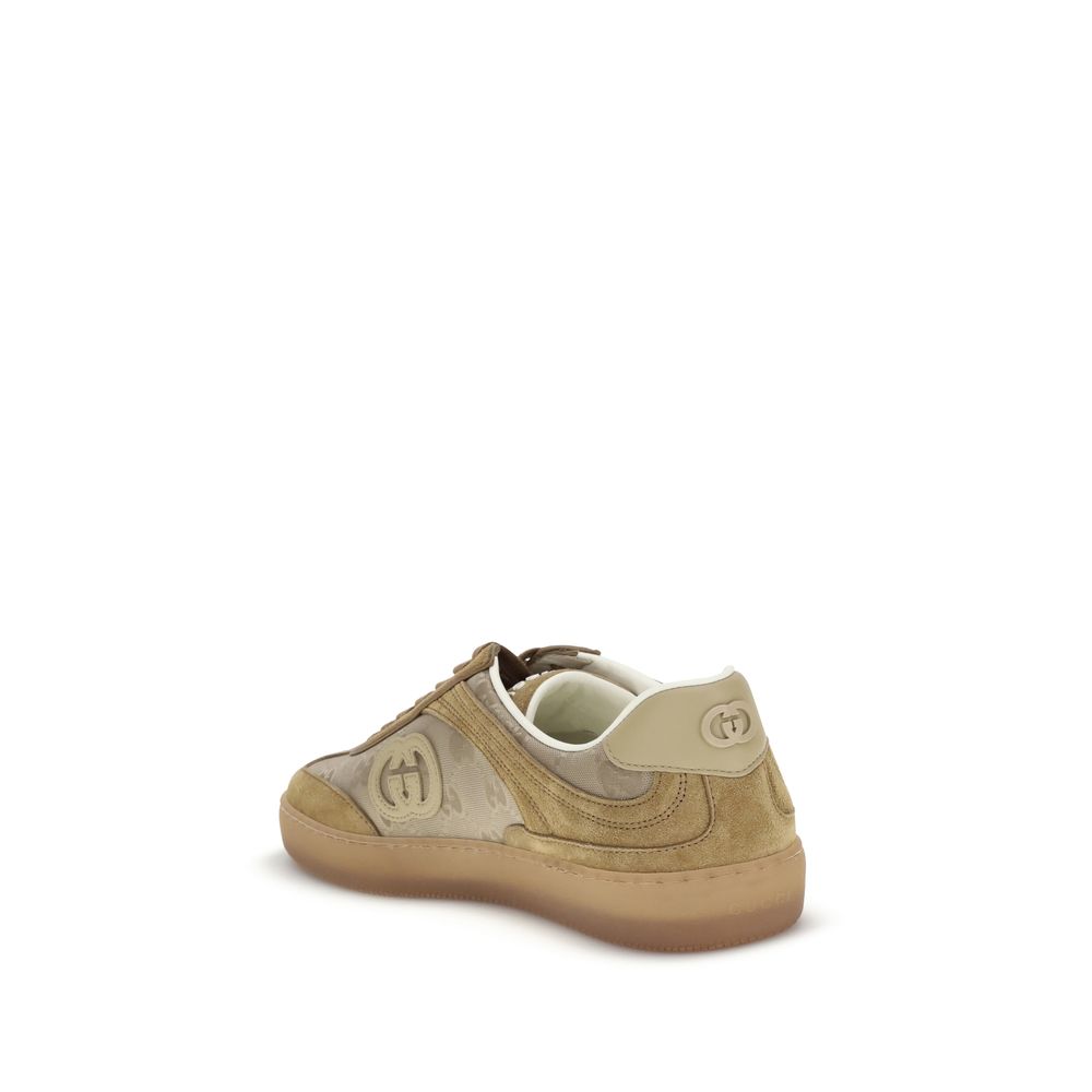 Beige Leather Athletic SneakersGucci’s G75 Sneakers reinterpret the retro sports aesthetic with premium materials and iconic details. Made of gray suede with GG nylon inserts, they feature a low-slung silhouette and a classic lace-up closure. The leather