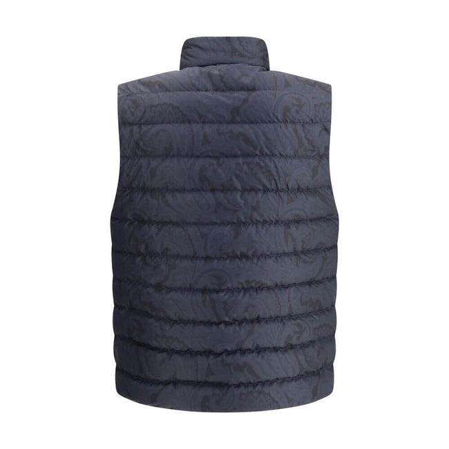 Blue Polyester Sleveless JacketEtro’s Down Vest is a refined-inspired garment enhanced by a tone-on-tone floral print that enhances its elegance. Featuring a high collar and concealed front button closure, it has practical side pockets and an adjustable d