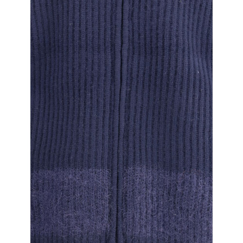 Blue Wool CardiganDsquared2’s zip Cardigan combines comfort and style with a sporty, refined design. Crafted in ribbed knit, it features a double-slider front zipper closure, high collar and two zipper pockets. The mohair band adds a distinctive, textured