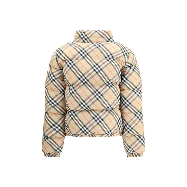 Beige Polyester CoatBurberry’s Check Down Jacket reinterprets an iconic brand feature with a functional and contemporary approach. Made in the unmistakable Burberry Check pattern, it features a regular fit and a double-slider zipper closure. The model fea