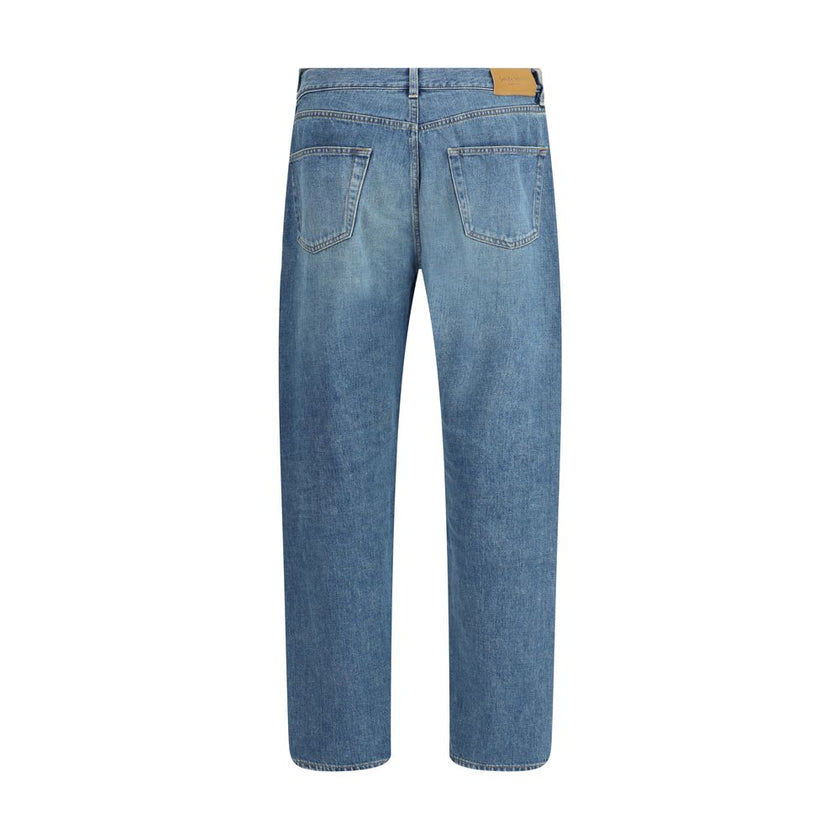 Blue Cotton Straight-Leg JeansSaint Laurent’s Mick Jeans are a timeless classic cut, crafted with a long straight-leg silhouette and a mid-rise waist. The five-pocket design is complemented by a zippered flap and button closure, while belt loops at the wa