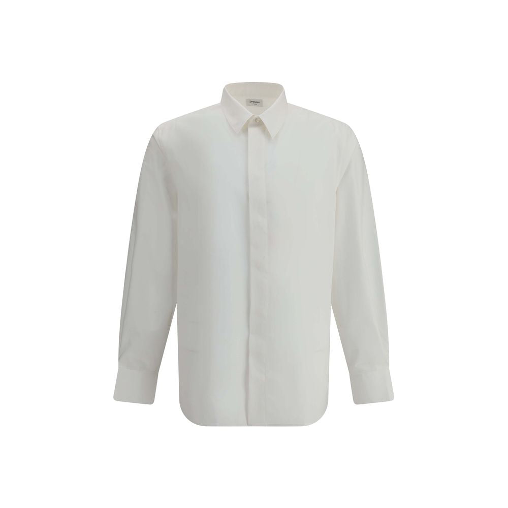 White Cotton Dress ShirtSaint Laurent’s cotton Shirt is a clean and elegant design. Made of cotton poplin, it features a classic collar, a front closure with concealed buttons for a minimal and neat effect, and a discreet but distinctive embroidered logo