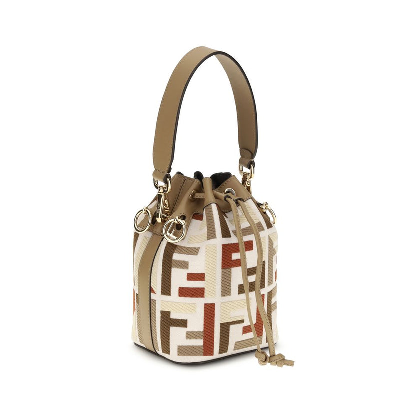 Multicolor Canvas Backet BagFendi’s Mon Tresor Bucket Bag is a style icon with a compact yet surprisingly roomy silhouette, perfect for accompanying every moment of the day. Made of natural-colored canvas, it is embellished with the embroidered FF motif e