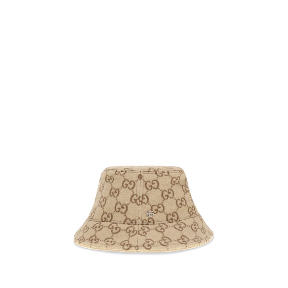 GG jacquard wool Bucket HatGucci’s GG jacquard wool Bucket Hat is a distinctive accessory that combines tradition and contemporary style. Crafted from soft wool, it features an elegant GG jacquard monogram motif, enhanced by a double-fabric lining for com