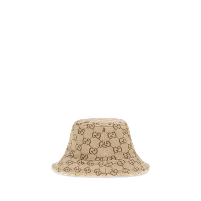 GG jacquard wool Bucket HatGucci’s GG jacquard wool Bucket Hat is a distinctive accessory that combines tradition and contemporary style. Crafted from soft wool, it features an elegant GG jacquard monogram motif, enhanced by a double-fabric lining for com