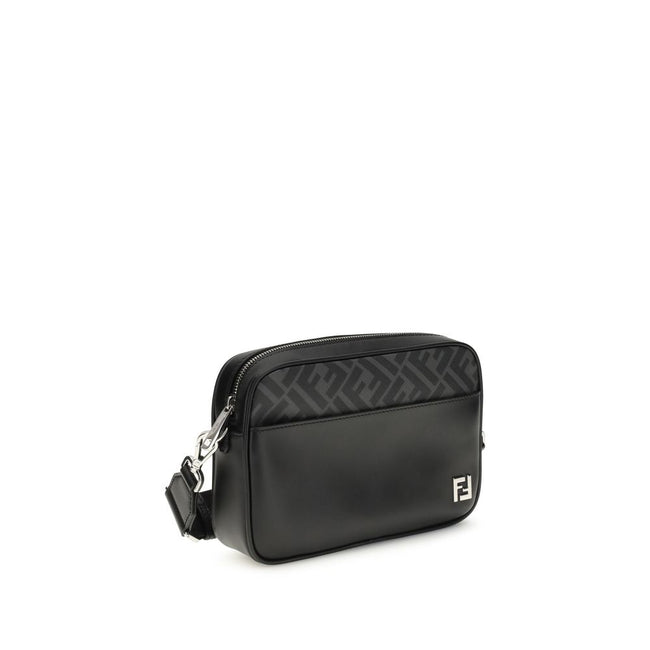 Black Leather Shoulder BagFendi’s FF leather and canvas Shoulder Bag is a compact model that combines elegance and functionality. Made of smooth black leather and FF Canvas in the same color, it is embellished with a metal FF logo applique. It features an