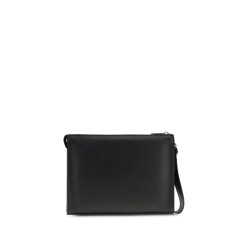 Black Leather Clutch BagFendi’s Pouch combines elegance and practicality with its fine workmanship in smooth leather and black FF canvas. Enriched by the application of the FF metal logo, it features a zipper closure and palladium-finish metal hardware. T