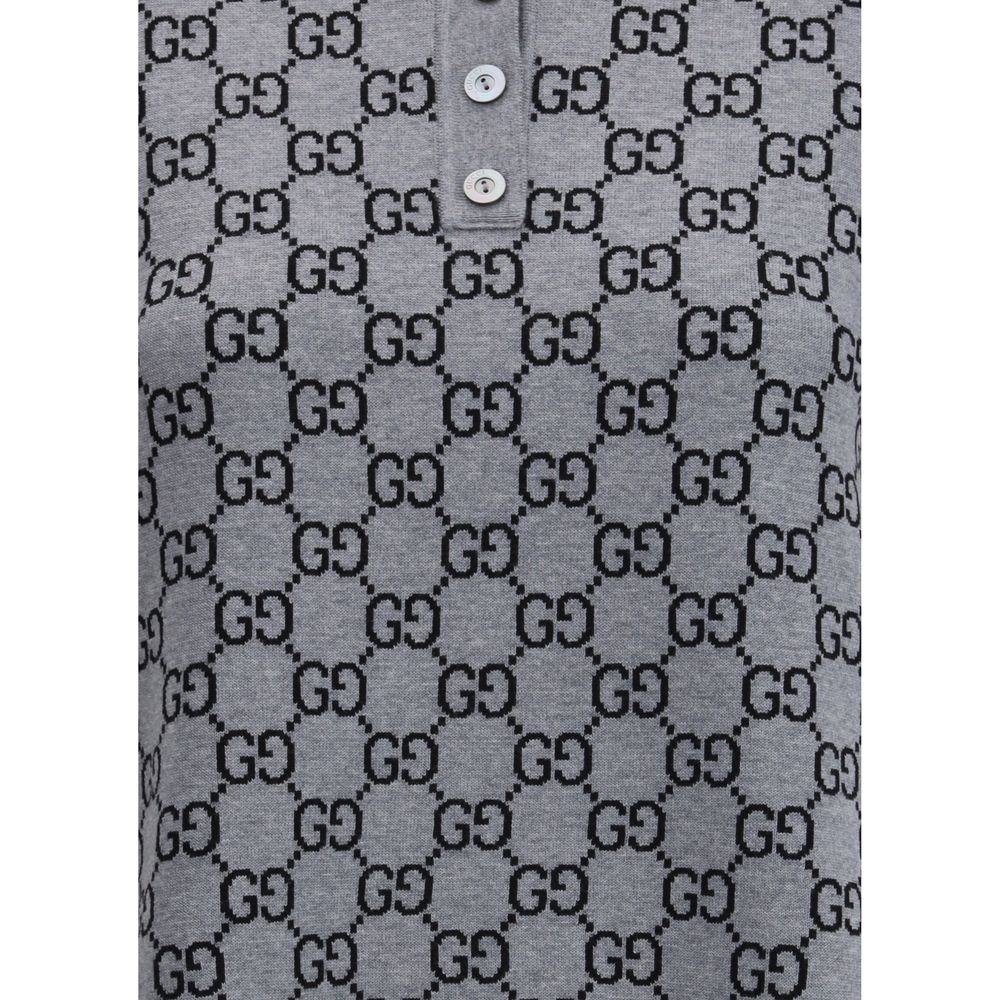 Gray Wool Casual DressGucci’s GG Supreme Polo Dress reinterprets the house’s iconic print in a short, sporty silhouette. Made with the classic GG Supreme pattern, it is complemented by a ribbed collar and hems that emphasize its tennis-inspired style. The