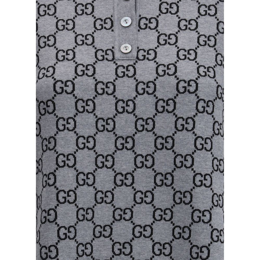 Gray Wool Casual DressGucci’s GG Supreme Polo Dress reinterprets the house’s iconic print in a short, sporty silhouette. Made with the classic GG Supreme pattern, it is complemented by a ribbed collar and hems that emphasize its tennis-inspired style. The