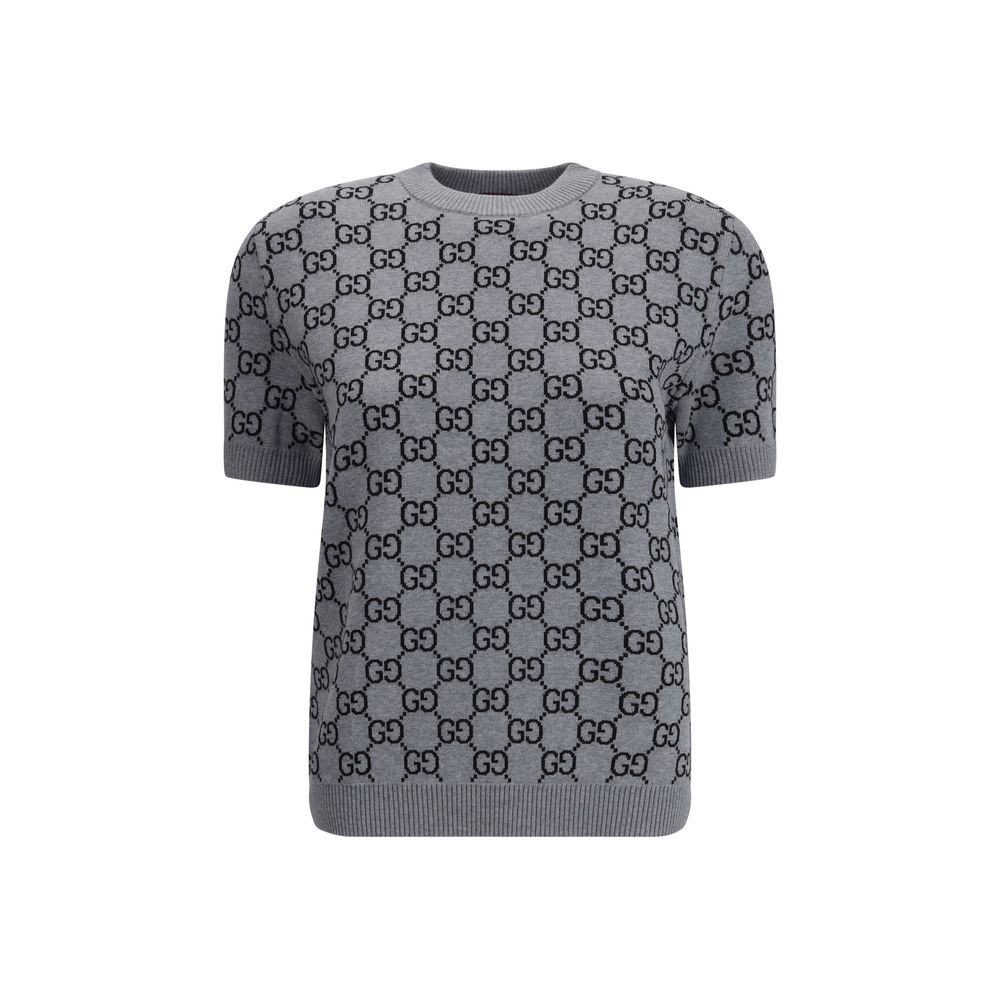 Gray Wool SweatshirtGucci’s short-sleeve Sweater is a retro-inspired piece that celebrates the house’s iconic aesthetic. Crafted in the unmistakable GG Supreme pattern, it features a ribbed crew neck and ribbed trim at the hem as well, defining the line w