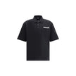 Black Cotton Polo ShirtDsquared2’s Polo Shirt combines classic style and distinctive details for a timeless look. Featuring a classic collar and a traditional three-button closure, it has a patch pocket on the front that adds functionality and character.