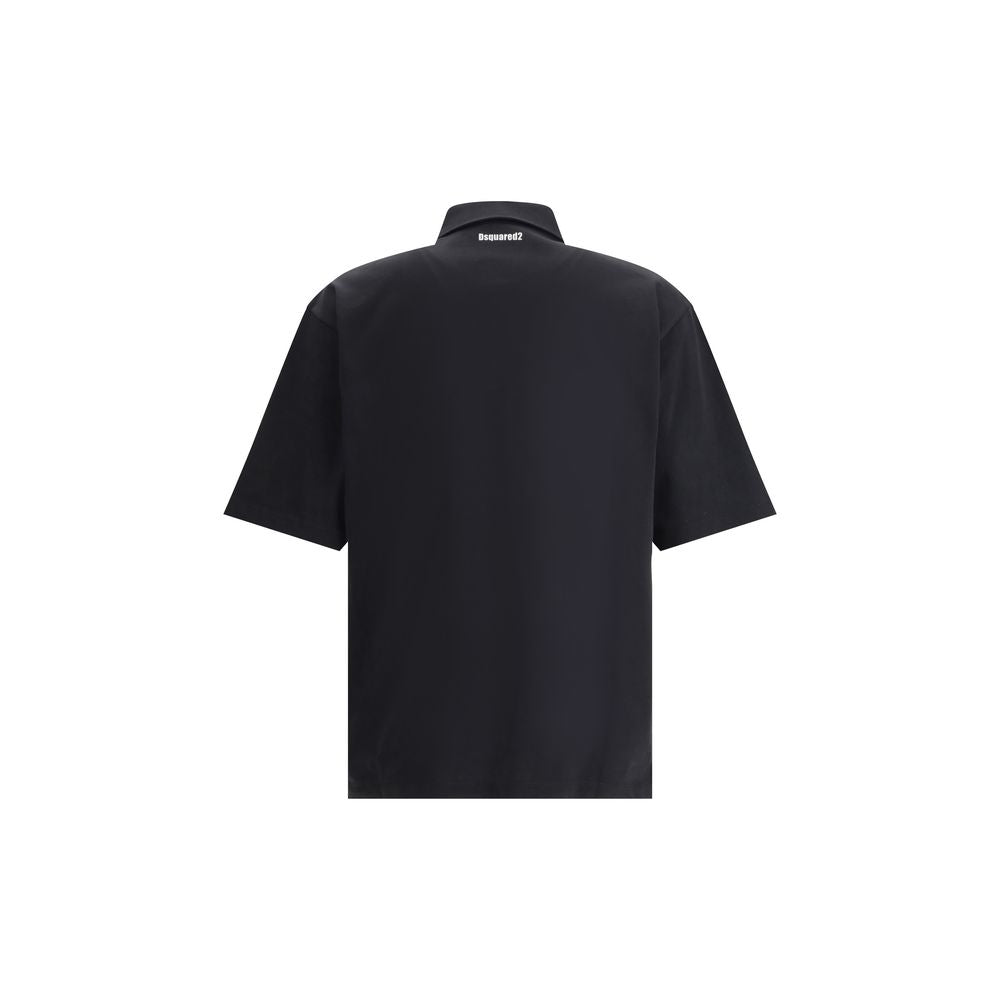 Black Cotton Polo ShirtDsquared2’s Polo Shirt combines classic style and distinctive details for a timeless look. Featuring a classic collar and a traditional three-button closure, it has a patch pocket on the front that adds functionality and character.