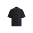 Black Cotton Polo ShirtDsquared2’s Polo Shirt combines classic style and distinctive details for a timeless look. Featuring a classic collar and a traditional three-button closure, it has a patch pocket on the front that adds functionality and character.