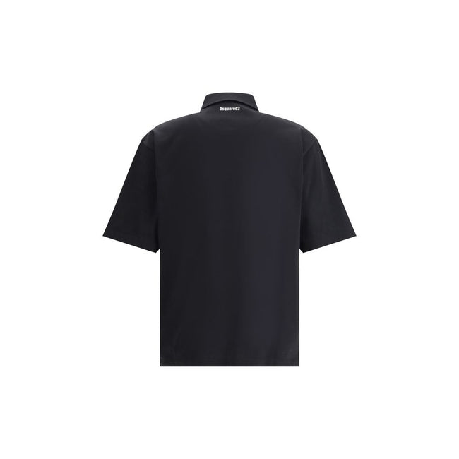 Black Cotton Polo ShirtDsquared2’s Polo Shirt combines classic style and distinctive details for a timeless look. Featuring a classic collar and a traditional three-button closure, it has a patch pocket on the front that adds functionality and character.