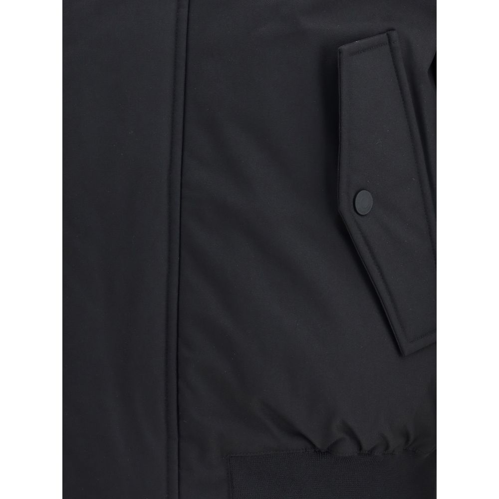 Black Polyester BomberThe Sport short Down Jacket by Dsquared2 is a padded garment with a functional and urban design. Featuring a hood and concealed front zipper and button closure, it has a ribbed elastic hem and cuffs for a comfortable fit. Two front w