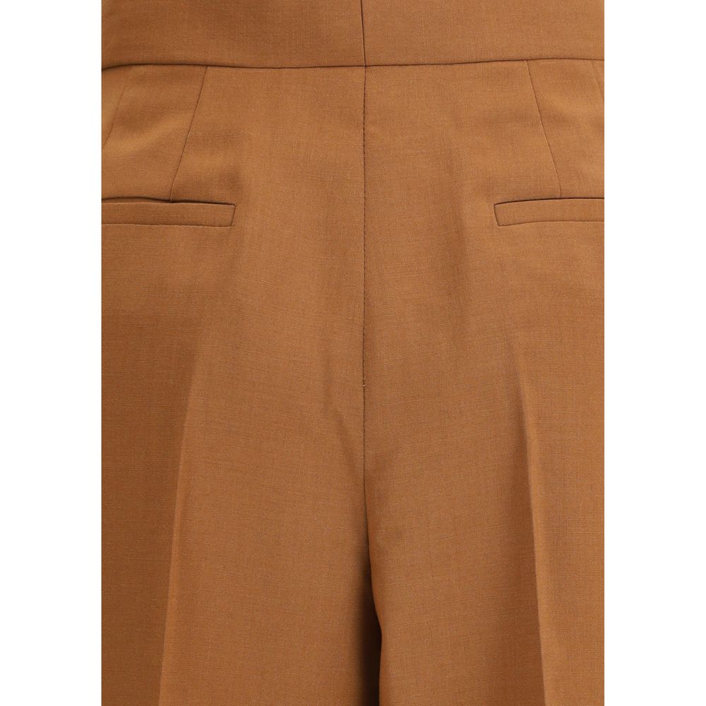 Brown Wool Flared PantsFendi’s Charleston Pants are an elegant high-waisted piece featuring a flared bottom line that gives movement and style. Featuring side pockets and a seamed pleat on the leg, they feature a covered zipper closure for a clean, refine