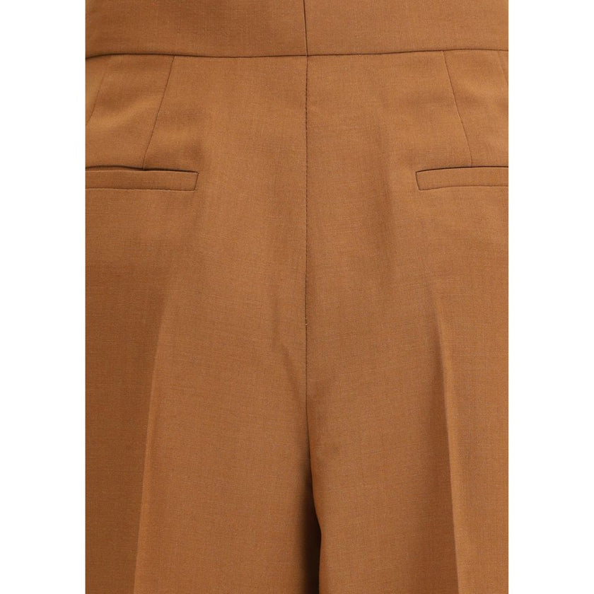Brown Wool Flared PantsFendi’s Charleston Pants are an elegant high-waisted piece featuring a flared bottom line that gives movement and style. Featuring side pockets and a seamed pleat on the leg, they feature a covered zipper closure for a clean, refine